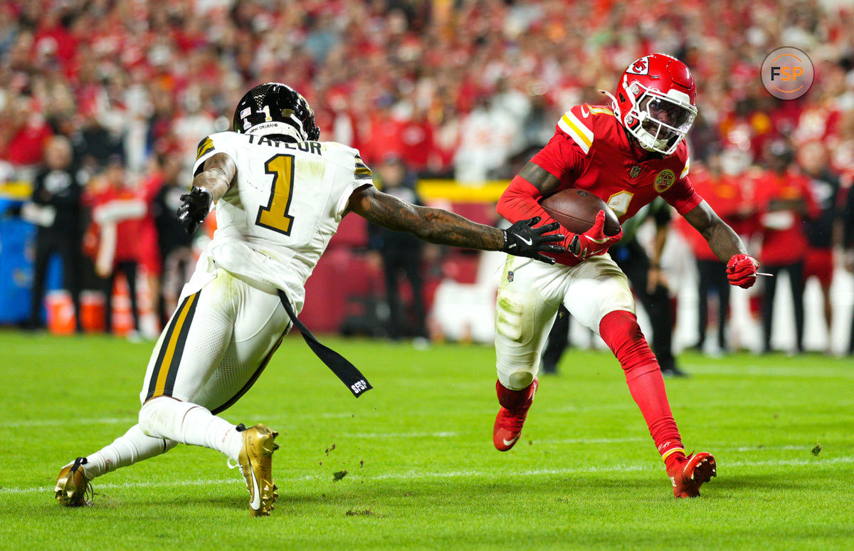 Oct 7, 2024; Kansas City, Missouri, USA; Kansas City Chiefs wide receiver Xavier Worthy (1) runs for a touchdown against New Orleans Saints cornerback Alontae Taylor (1) during the second half at GEHA Field at Arrowhead Stadium. Credit: Jay Biggerstaff-Imagn Images