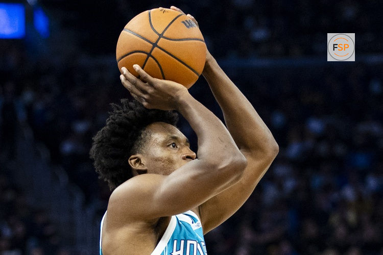 Jan 17, 2026; San Francisco, California, USA; Charlotte Hornets guard Collin Sexton (8) takes a three-point shot against the Golden State Warriors during the third quarter at Chase Center. Credit: John Hefti-Imagn Images