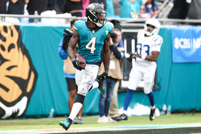 Oct 6, 2024; Jacksonville, Florida, USA; Jacksonville Jaguars running back Tank Bigsby (4) scores a touchdown against the Indianapolis Colts in the fourth quarter at EverBank Stadium. Mandatory Credit: Nathan Ray Seebeck-Imagn Images