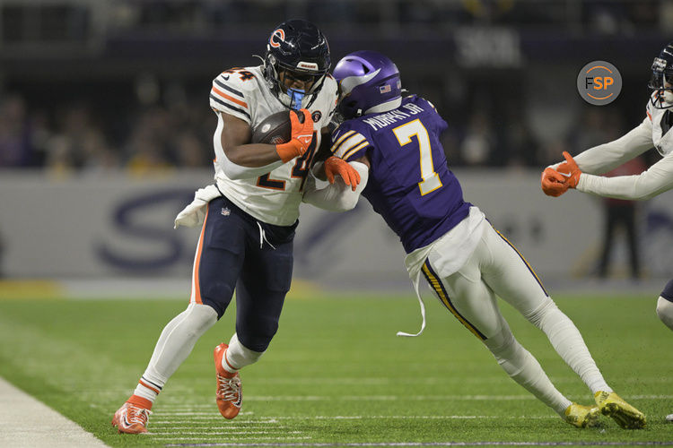 MINNEAPOLIS, MN - NOVEMBER 27: Chicago Bears running back Khalil Herbert (24) is knocked out of bounds by Minnesota Vikings defensive back Byron Murphy (7) during an NFL game between the Minnesota Vikings and Chicago Bears on November 27, 2023, at U.S. Bank Stadium in Minneapolis, MN. (Photo by Nick Wosika/Icon Sportswire)