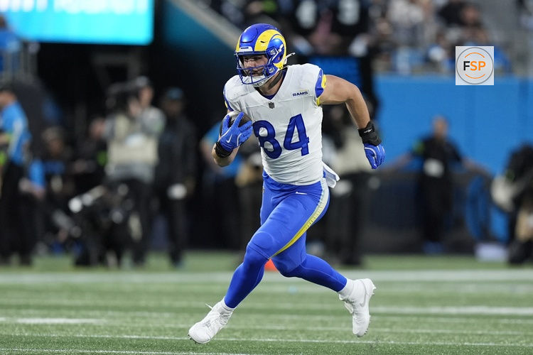 Jan 10, 2026; Charlotte, NC, USA; Los Angeles Rams tight end Colby Parkinson (84) makes a catch against the Carolina Panthers in the first half during the NFC Wild Card Round game at Bank of America Stadium. Credit: Jim Dedmon-Imagn Images