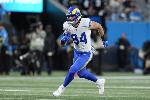 Jan 10, 2026; Charlotte, NC, USA; Los Angeles Rams tight end Colby Parkinson (84) makes a catch against the Carolina Panthers in the first half during the NFC Wild Card Round game at Bank of America Stadium. Mandatory Credit: Jim Dedmon-Imagn Images