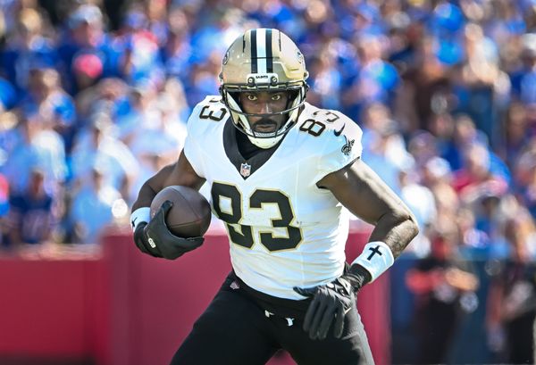 Sep 28, 2025; Orchard Park, New York, USA; New Orleans Saints tight end Juwan Johnson (83) runs after making a catch against the Buffalo Bills in the first quarter at Highmark Stadium. Mandatory Credit: Mark Konezny-Imagn Images