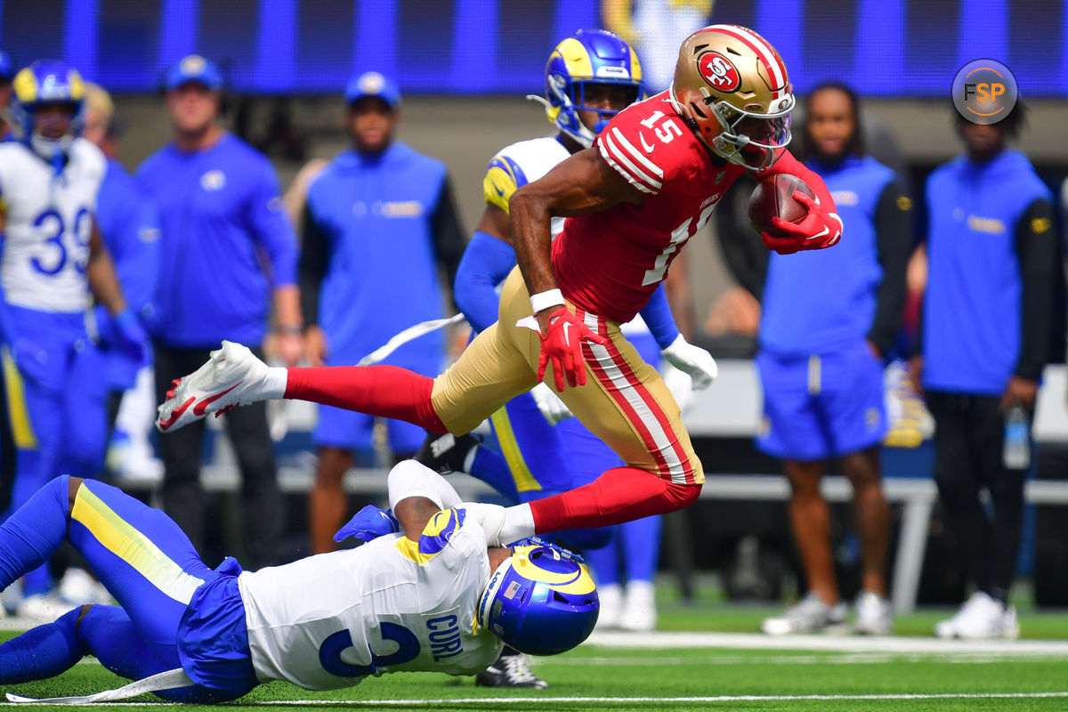 Sep 22, 2024; Inglewood, California, USA; San Francisco 49ers wide receiver Jauan Jennings (15) runs the ball against Los Angeles Rams safety Kamren Curl (3) during the first half at SoFi Stadium. Credit: Gary A. Vasquez-Imagn Images