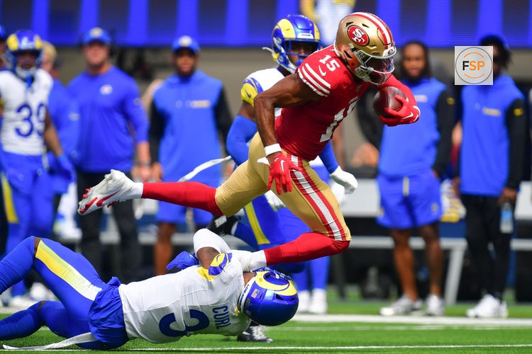 Sep 22, 2024; Inglewood, California, USA; San Francisco 49ers wide receiver Jauan Jennings (15) runs the ball against Los Angeles Rams safety Kamren Curl (3) during the first half at SoFi Stadium. Credit: Gary A. Vasquez-Imagn Images