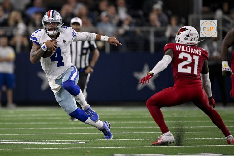 Nov 3, 2025; Arlington, Texas, USA; Dallas Cowboys quarterback Dak Prescott (4) runs with the ball past Arizona Cardinals cornerback Garrett Williams (21) during the game between the Dallas Cowboys and the Arizona Cardinals at AT&T Stadium. Credit: Jerome Miron-Imagn Images