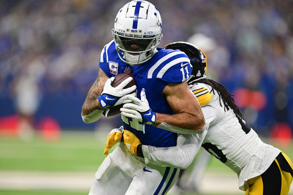 Sep 29, 2024; Indianapolis, Indiana, USA; Indianapolis Colts wide receiver Michael Pittman Jr. (11) is tackled by Pittsburgh Steelers cornerback Donte Jackson (26) during the second quarter at Lucas Oil Stadium. Mandatory Credit: Marc Lebryk-Imagn Images