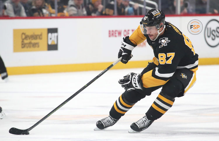 Feb 4, 2025; Pittsburgh, Pennsylvania, USA;  Pittsburgh Penguins center Sidney Crosby (87) handles the puck against the New Jersey Devils during the third period at PPG Paints Arena. Credit: Charles LeClaire-Imagn Images