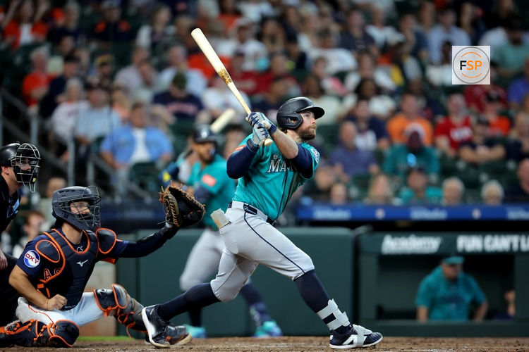 May 14, 2026; Houston, Texas, USA; Seattle Mariners third baseman Brendan Donovan (33) hits a triple to right field against the Houston Astros during the third inning at Daikin Park. Credit: Erik Williams-Imagn Images