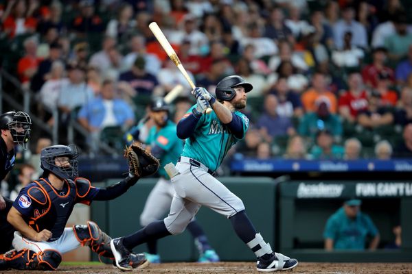 May 14, 2026; Houston, Texas, USA; Seattle Mariners third baseman Brendan Donovan (33) hits a triple to right field against the Houston Astros during the third inning at Daikin Park. Mandatory Credit: Erik Williams-Imagn Images