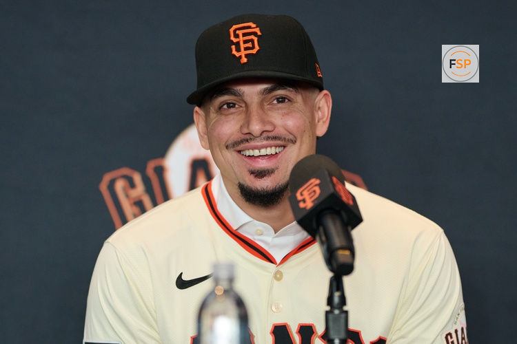 Dec 12, 2024; San Francisco, CA, USA; San Francisco Giants shortstop Willy Adames reacts during his introductory press conference at Oracle Park.  Credit: Robert Edwards-Imagn Images