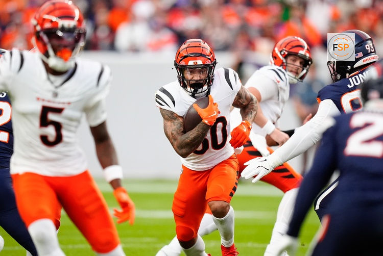 Sep 29, 2025; Denver, Colorado, USA; Cincinnati Bengals running back Chase Brown (30) rushes during the first quarter against the Denver Broncos at Empower Field at Mile High. Credit: Ron Chenoy-Imagn Images