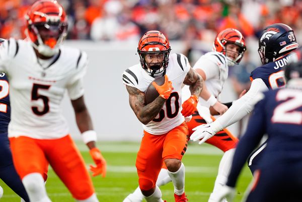Sep 29, 2025; Denver, Colorado, USA; Cincinnati Bengals running back Chase Brown (30) rushes during the first quarter against the Denver Broncos at Empower Field at Mile High. Mandatory Credit: Ron Chenoy-Imagn Images