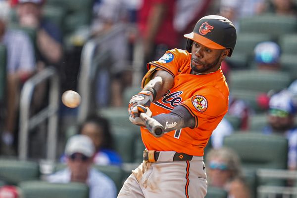 Jul 5, 2025; Cumberland, Georgia, USA; Baltimore Orioles center fielder Cedric Mullins (31) hits a double against the Atlanta Braves during the seventh inning at Truist Park. Mandatory Credit: Dale Zanine-Imagn Images