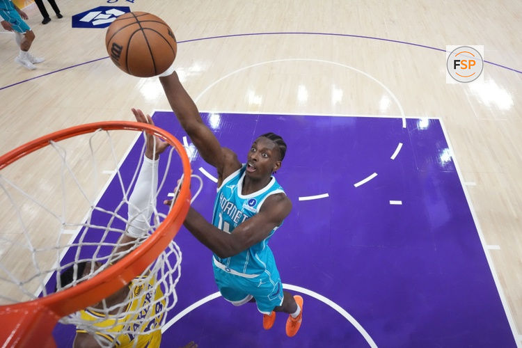 Jan 15, 2026; Los Angeles, California, USA; Charlotte Hornets forward Moussa Diabate (14) shoots the ball against Los Angeles Lakers forward Rui Hachimura (28) in the first half at Crypto.com Arena. Credit: Kirby Lee-Imagn Images