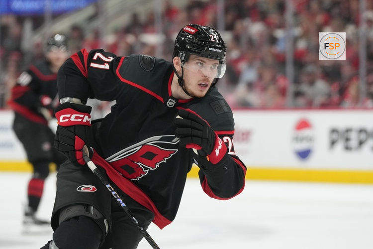 May 28, 2025; Raleigh, North Carolina, USA; Carolina Hurricanes defenseman Alexander Nikishin (21) skates against Florida Panthers during the third period in game five of the Eastern Conference Final of the 2025 Stanley Cup Playoffs at Lenovo Center. Credit: James Guillory-Imagn Images
