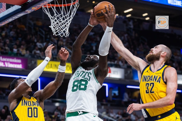 Dec 26, 2025; Indianapolis, Indiana, USA; Boston Celtics center Neemias Queta (88) shoots the ball while  Indiana Pacers center Jay Huff (32) defends in the second half at Gainbridge Fieldhouse. Credit: Trevor Ruszkowski-Imagn Images