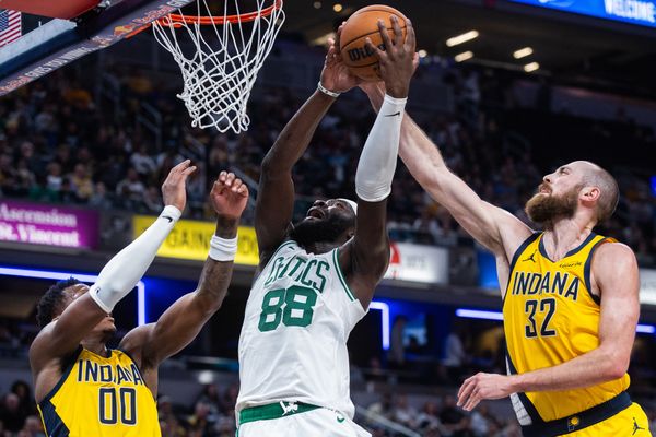 Dec 26, 2025; Indianapolis, Indiana, USA; Boston Celtics center Neemias Queta (88) shoots the ball while  Indiana Pacers center Jay Huff (32) defends in the second half at Gainbridge Fieldhouse. Mandatory Credit: Trevor Ruszkowski-Imagn Images