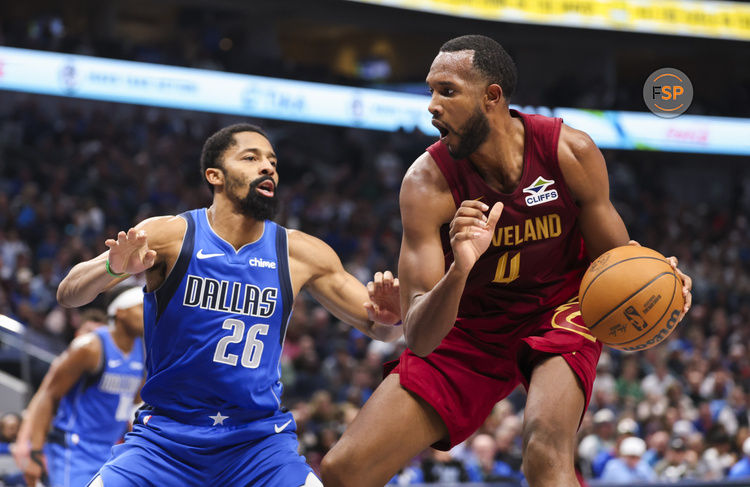 Jan 3, 2025; Dallas, Texas, USA;  Cleveland Cavaliers forward Evan Mobley (4) drives to the basket as Dallas Mavericks guard Spencer Dinwiddie (26) defends during the first half at American Airlines Center. Credit: Kevin Jairaj-Imagn Images