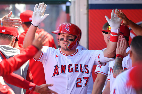 ANAHEIM, CA - APRIL 24: Los Angeles Angels designated hitter Mike Trout (27) gets high fives in the dugout after hitting a solo home run during the MLB game between the Baltimore Orioles and the Los Angeles Angels of Anaheim on April 24, 2024 at Angel Stadium of Anaheim in Anaheim, CA. (Photo by Brian Rothmuller/Icon Sportswire)