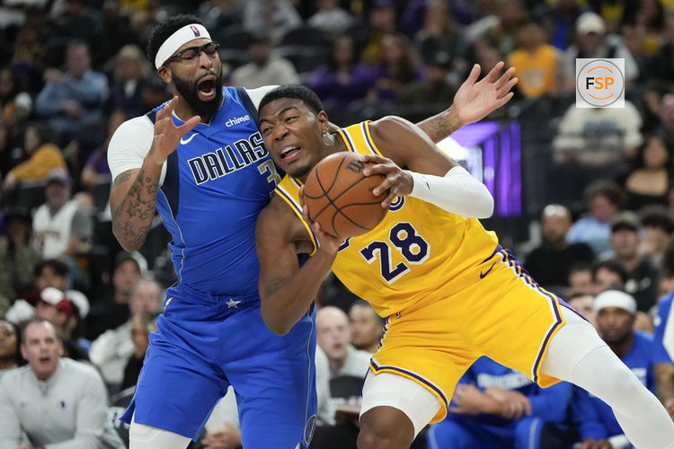 Oct 15, 2025; Las Vegas, Nevada, USA; Los Angeles Lakers forward Rui Hachimura (28) drives the ball against Dallas Mavericks forward Anthony Davis (3) during the second half at T-Mobile Arena. Credit: Lucas Peltier-Imagn Images