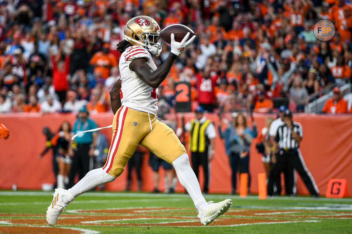 DENVER, CO - SEPTEMBER 25: San Francisco 49ers wide receiver Brandon Aiyuk (11) scores a first half touchdown after a reception against the Denver Broncos during a game between the San Francisco 49ers and the Denver Broncos at Empower Field at Mile High on September 25, 2022 in Denver, Colorado. (Photo by Dustin Bradford/Icon Sportswire)