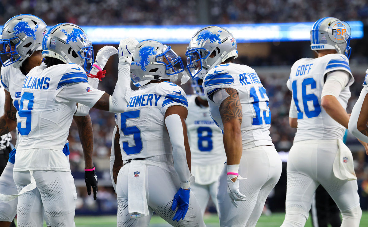 Oct 13, 2024; Arlington, Texas, USA;  Detroit Lions running back David Montgomery (5) and Detroit Lions running back Craig Reynolds (13) and Detroit Lions wide receiver Jameson Williams (9) celebrate a touchdown during the first quarter against the Dallas Cowboys at AT&T Stadium. Credit: Kevin Jairaj-Imagn Images