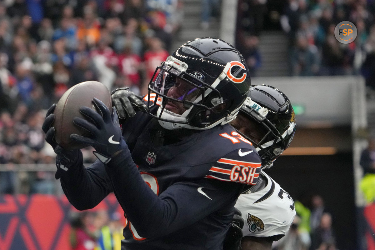 Oct 13, 2024; London, United Kingdom; Chicago Bears wide receiver Keenan Allen (13) catches a three-yard touchdown pass against Jacksonville Jaguars cornerback Montaric Brown (30) in the second half during an NFL International Series game at Tottenham Hotspur Stadium. Credit: Kirby Lee-Imagn Images