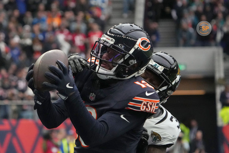 Oct 13, 2024; London, United Kingdom; Chicago Bears wide receiver Keenan Allen (13) catches a three-yard touchdown pass against Jacksonville Jaguars cornerback Montaric Brown (30) in the second half during an NFL International Series game at Tottenham Hotspur Stadium. Credit: Kirby Lee-Imagn Images