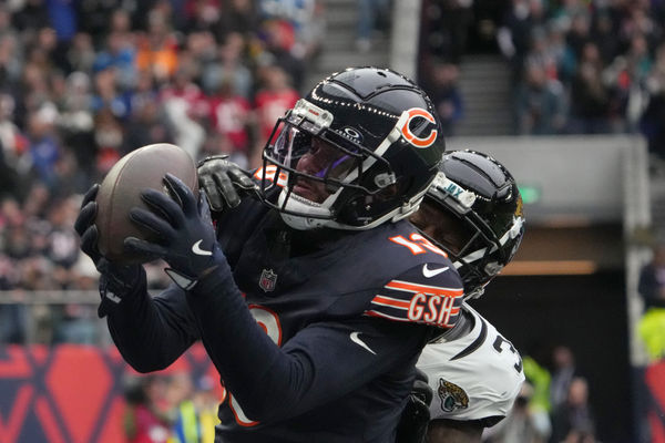 Oct 13, 2024; London, United Kingdom; Chicago Bears wide receiver Keenan Allen (13) catches a three-yard touchdown pass against Jacksonville Jaguars cornerback Montaric Brown (30) in the second half during an NFL International Series game at Tottenham Hotspur Stadium. Mandatory Credit: Kirby Lee-Imagn Images