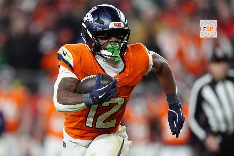 Dec 14, 2025; Denver, Colorado, USA; Denver Broncos running back RJ Harvey (12) runs for a gain during the fourth quarter against the Green Bay Packers at Empower Field at Mile High. Credit: Ron Chenoy-Imagn Images