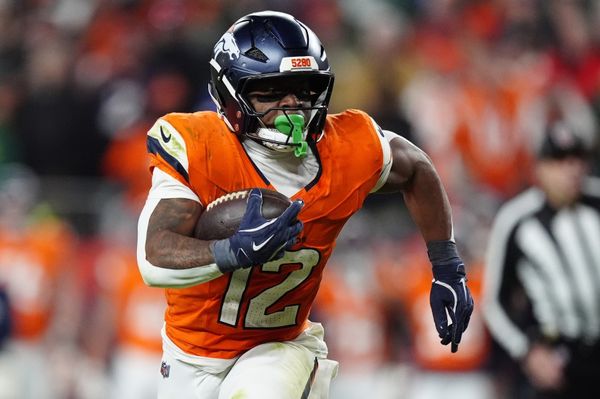 Dec 14, 2025; Denver, Colorado, USA; Denver Broncos running back RJ Harvey (12) runs for a gain during the fourth quarter against the Green Bay Packers at Empower Field at Mile High. Mandatory Credit: Ron Chenoy-Imagn Images