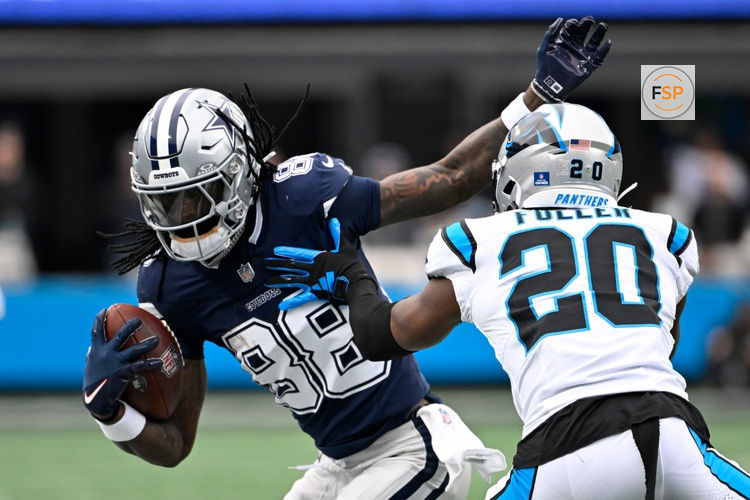 Dec 15, 2024; Charlotte, North Carolina, USA;  Dallas Cowboys wide receiver CeeDee Lamb (88) with the ball as Carolina Panthers safety Jordan Fuller (20) defends in the second quarter at Bank of America Stadium. Credit: Bob Donnan-Imagn Images