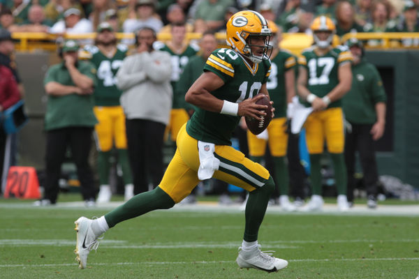 GREEN BAY, WI - AUGUST 26: Green Bay Packers quarterback Jordan Love (10) rushes for a first down during a game between the Green Bay Packers and the Seattle Seahawks at Lambeau Field on August 26, 2023 in Green Bay, WI. (Photo by Larry Radloff/Icon Sportswire)