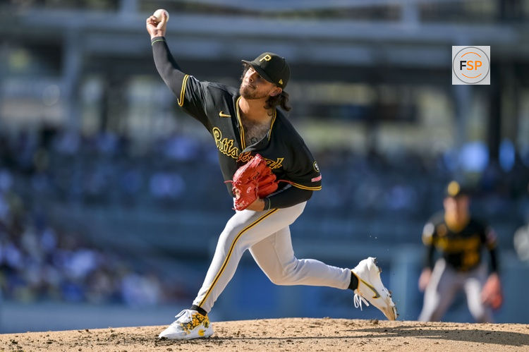 Aug 22, 2026; Los Angeles, California, USA; Pittsburgh Pirates pitcher Jared Jones (17) pitches during the second inning at Dodger Stadium. Credit: Jayne Kamin-Oncea-Imagn Images