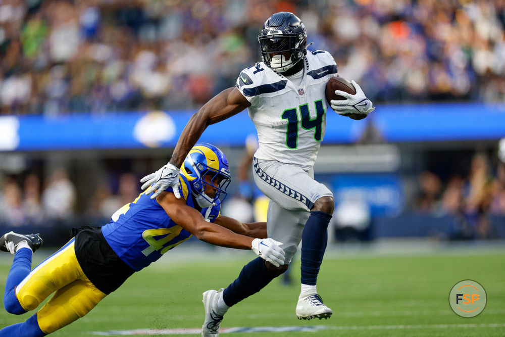 INGLEWOOD, CA - NOVEMBER 19: Seattle Seahawks wide receiver DK Metcalf (14) runs with the ball in the second quarter during an NFL regular season game between the Seattle Seahawks and the Los Angeles Rams on November 19, 2023, at SoFi Stadium in Inglewood, CA. (Photo by Brandon Sloter/Icon Sportswire)