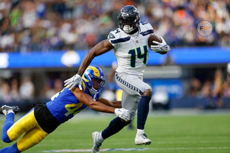 INGLEWOOD, CA - NOVEMBER 19: Seattle Seahawks wide receiver DK Metcalf (14) runs with the ball in the second quarter during an NFL regular season game between the Seattle Seahawks and the Los Angeles Rams on November 19, 2023, at SoFi Stadium in Inglewood, CA. (Photo by Brandon Sloter/Icon Sportswire)