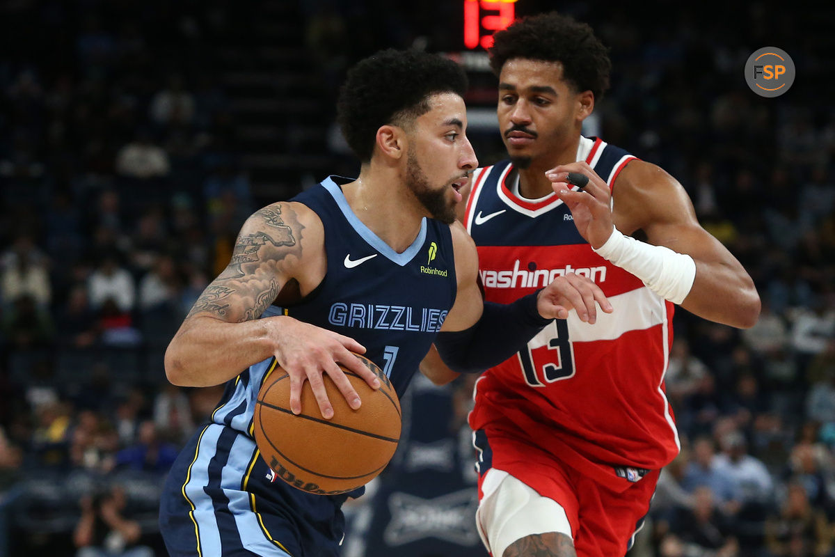 Nov 8, 2024; Memphis, Tennessee, USA; Memphis Grizzlies guard Scotty Pippen Jr. (1) drives against Washington Wizards guard Jordan Poole (13) during the second half at FedExForum. Credit: Petre Thomas-Imagn Images