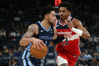 Nov 8, 2024; Memphis, Tennessee, USA; Memphis Grizzlies guard Scotty Pippen Jr. (1) drives against Washington Wizards guard Jordan Poole (13) during the second half at FedExForum. Mandatory Credit: Petre Thomas-Imagn Images