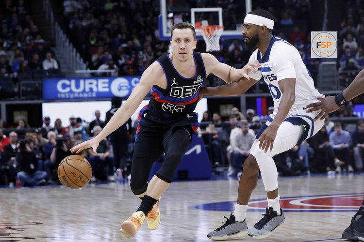 Apr 02, 2026; Detroit, Michigan, USA; Detroit Pistons forward Duncan Robinson (55) dribbles the ball while defended by Minnesota Timberwolves guard Mike Conley (10) in the first half at Little Caesars Arena. Credit: Rick Osentoski-Imagn Images
