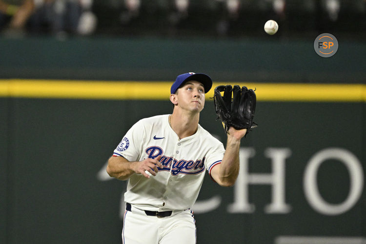 Sep 17, 2024; Arlington, Texas, USA; Texas Rangers left fielder Wyatt Langford (36) catches a fly ball during the game against the Toronto Blue Jays at Globe Life Field. Credit: Jerome Miron-Imagn Images