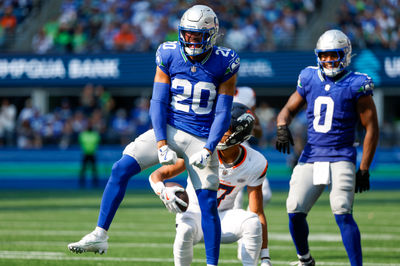 Sep 8, 2024; Seattle, Washington, USA; Seattle Seahawks safety Julian Love (20) celebrates after making a tackle against the Denver Broncos during the third quarter at Lumen Field. Mandatory Credit: Joe Nicholson-Imagn Images