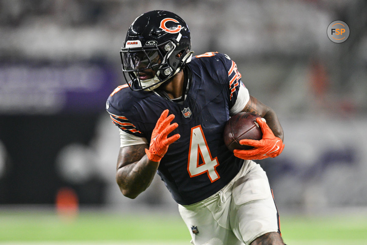 Dec 16, 2024; Minneapolis, Minnesota, USA; Chicago Bears running back D'Andre Swift (4) runs the ball against the Minnesota Vikings during the third quarter at U.S. Bank Stadium. Credit: Jeffrey Becker-Imagn Images