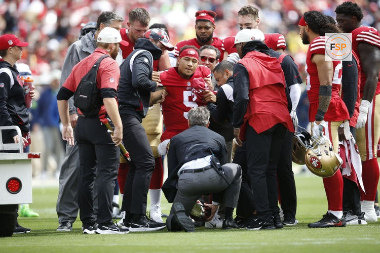 SANTA CLARA, CA - SEPTEMBER 18: Trey Lance #5 of the San Francisco 49ers gets helped off the field with a fractured ankle during the game against the Seattle Seahawks at Levi's Stadium on September 18, 2022 in Santa Clara, California. The 49ers defeated the Seahawks 27-7. (Photo by Michael Zagaris/San Francisco 49ers/Getty Images)  *** Local Caption *** Trey Lance