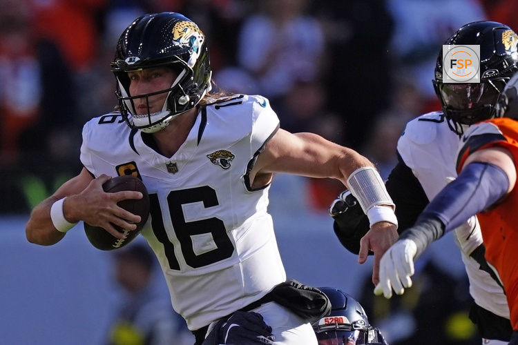 Dec 21, 2025; Denver, Colorado, USA; Jacksonville Jaguars quarterback Trevor Lawrence (16) rushes the ball against the Denver Broncos during the first half  at Empower Field at Mile High. Credit: Ron Chenoy-Imagn Images