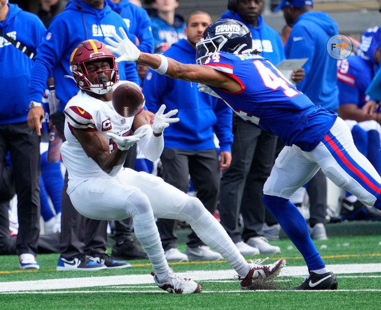 Oct 22, 2023; East Rutherford, New Jersey, USA; Washington Commanders wide receiver Terry McLaurin (17) unable hang on to a first half pass as New York Giants cornerback Nick McCloud (44) defends at MetLife Stadium. Credit: Robert Deutsch-USA TODAY Sports