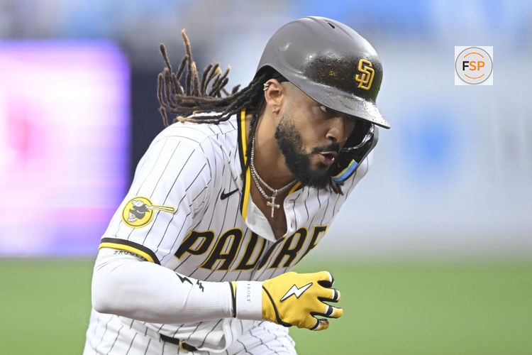 May 27, 2025; San Diego, California, USA; San Diego Padres outfielder Fernando Tatis Jr. (23) rounds the bases after hitting a solo home run during the first inning against the Miami Marlins at Petco Park. Credit: Denis Poroy-Imagn Images