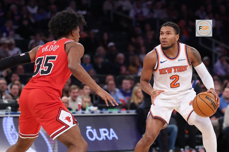 Nov 2, 2025; New York, New York, USA; New York Knicks guard Miles McBride (2) looks to the basket  as Chicago Bulls forward Isaac Okoro (35) defends during the second half at Madison Square Garden. Credit: Vincent Carchietta-Imagn Images