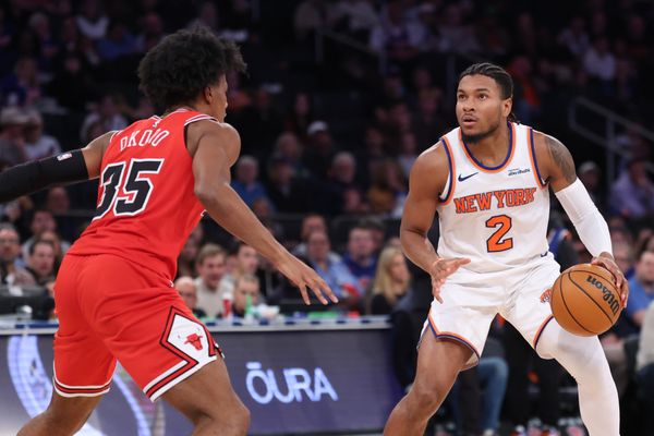 Nov 2, 2025; New York, New York, USA; New York Knicks guard Miles McBride (2) looks to the basket  as Chicago Bulls forward Isaac Okoro (35) defends during the second half at Madison Square Garden. Mandatory Credit: Vincent Carchietta-Imagn Images