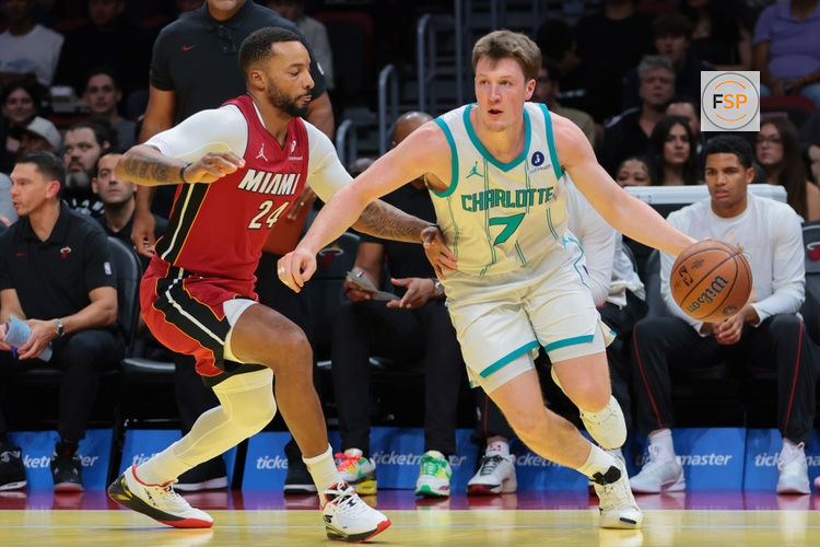 Nov 7, 2025; Miami, Florida, USA; Charlotte Hornets guard Kon Knueppel (7) drives to the basket against Miami Heat guard Norman Powell (24) during the first quarter of an NBA Cup game at Kaseya Center. Credit: Sam Navarro-Imagn Images